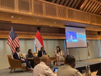 Panel discussion with U.S. and Indonesian flags